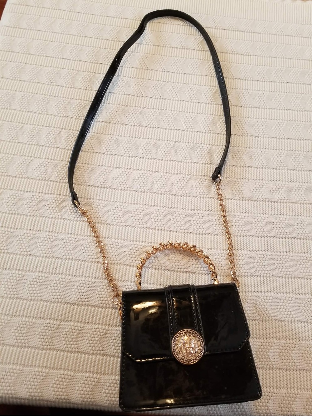 Aldo Mini Black Patent Crossbody with Gold Chain and Medallion